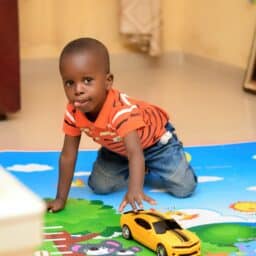 Young boy playing at daycare.