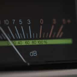 Analog decibel meter of a vintage stereo amplifier with needle indicator