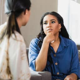Woman listening intently to her friend.
