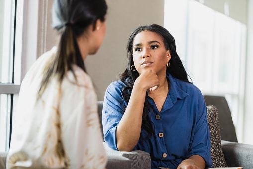 Woman listening intently to her friend.